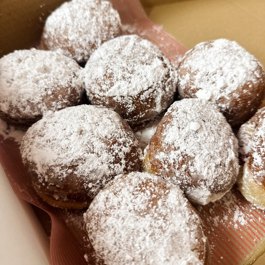 Chanukah specials - powdered sugar jam doughnuts